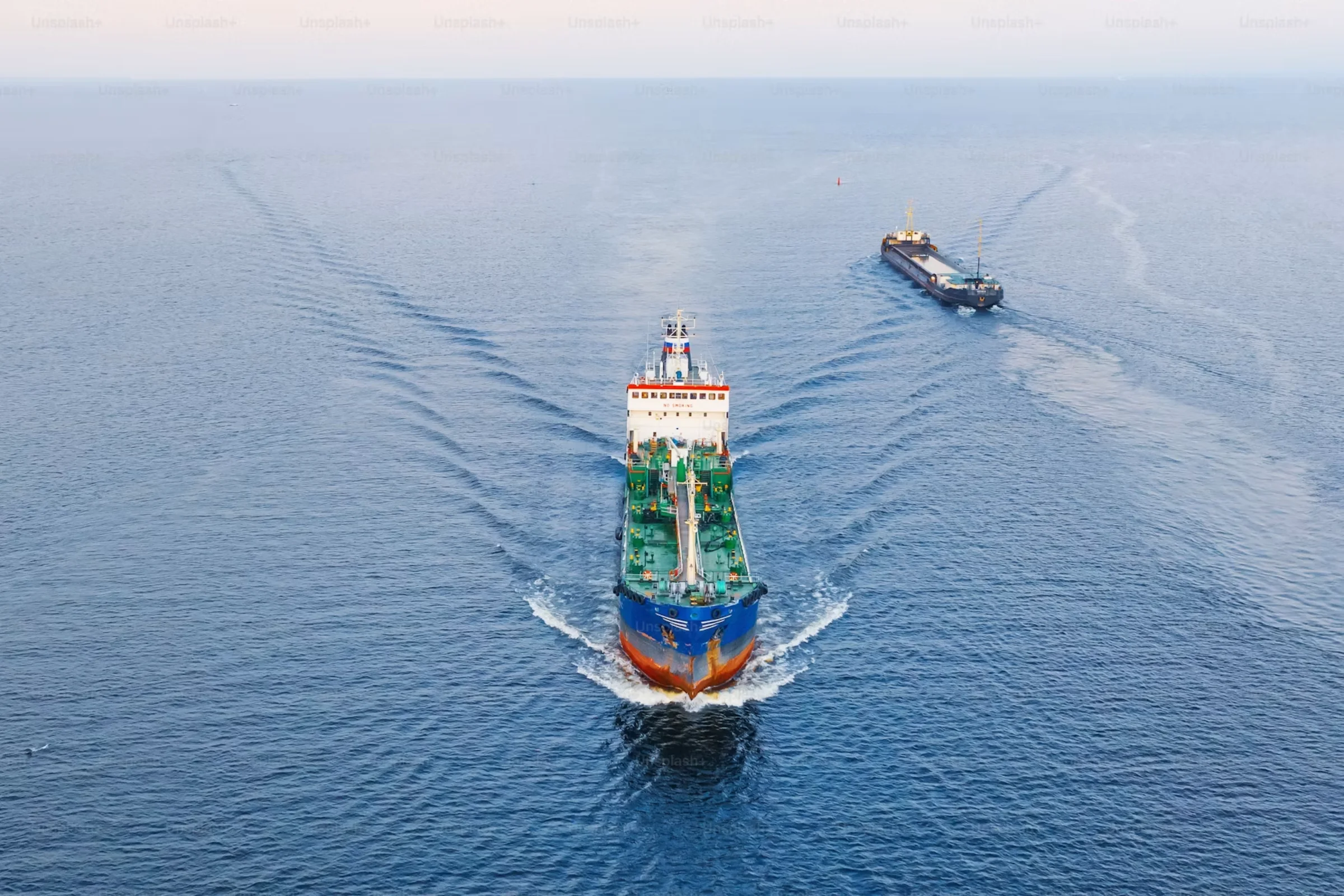 Tanker vessel underway with support craft for one stop marine MRO supply
