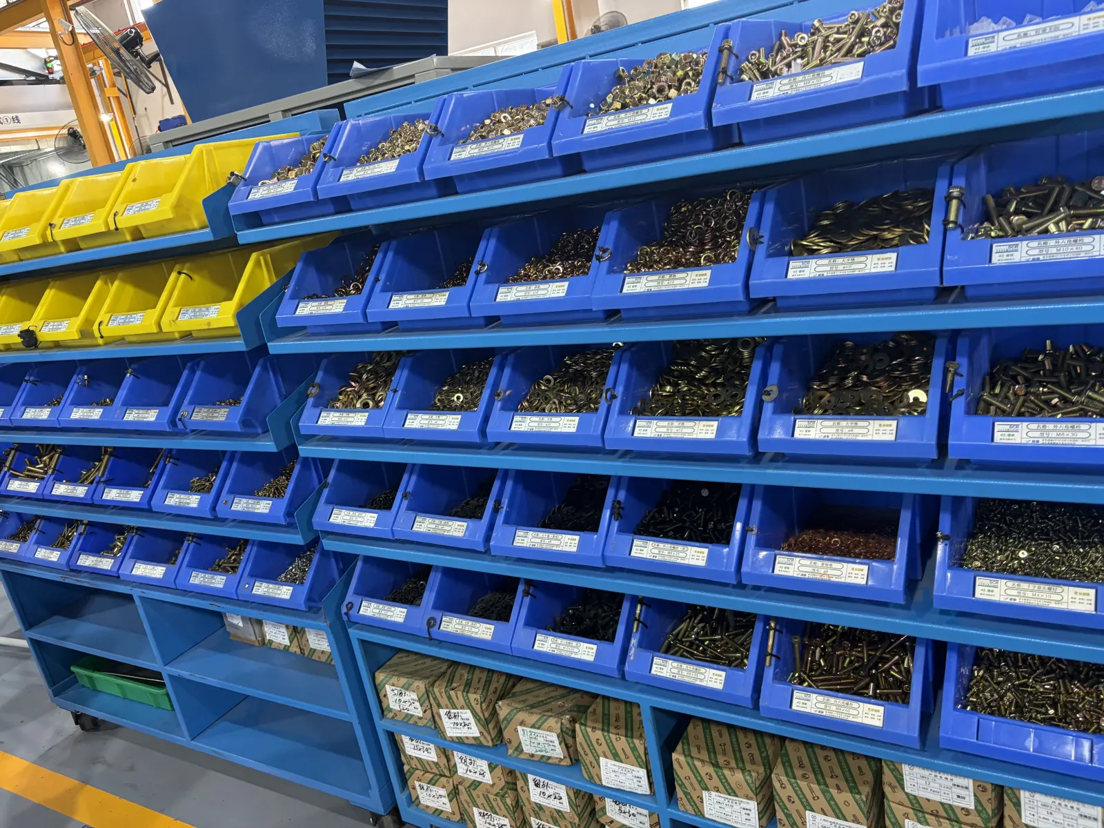 Sorted fasteners and small parts in storage bins
